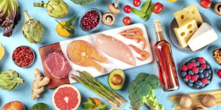 Food, overhead panorama on a blue background. Meat, fish, seafood, poultry, wine, cheese,
