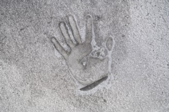 01/05/2023, Berlin, Germany, Europe, A handprint left on the tarmac with superglue a few days after