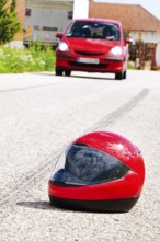 An accident involving a motorbike. Traffic accident with skid mark on road Symbol photo. Austria