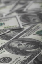 One hundred US dollars bills pile. Selective focus