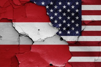 Flags of Austria and USA painted on cracked wall