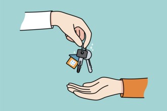 Realtor or broker give keys to client or buyer greeting with purchase. Real estate agent