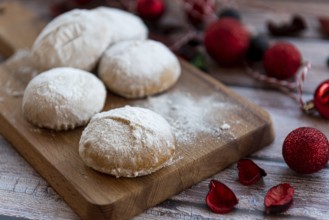 Traditional delicious Greek almond snow balls or Christmas cookies called kourabiedes with almonds