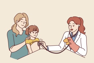 Woman doctor pediatrician applies stethoscope to chest of child sitting on lap of happy mother.