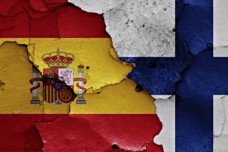 Flags of Spain and Finland painted on cracked wall