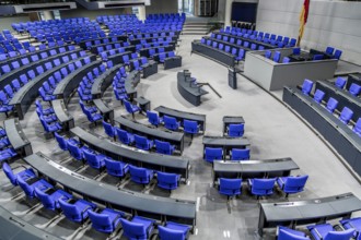 View into the empty plenary chamber of the German Bundestag, plenary chamber with blue chairs