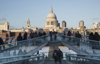 London, United Kingdom, December 8 2015: People walking at the Millennium bridge, officially known