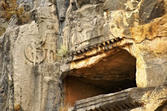 Pictures & images of the ancient Lycian rock cut tomb of a Gladiator whose rock relief sculpture