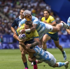 Jul 25, 2024-Paris, FRA, Men?s Pool B Rugby Seven: Team Australia back Corey Toole (3) (AUS) fights