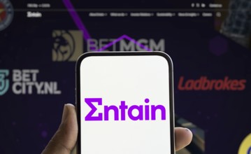 Dhaka, Bangladesh- 28 Nov 2024: Entain logo is displayed on smartphone.Entain plc is an