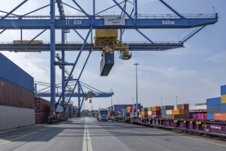Crane loads containers onto trains and lorries at the D3T container port, Logport l, Rhine,