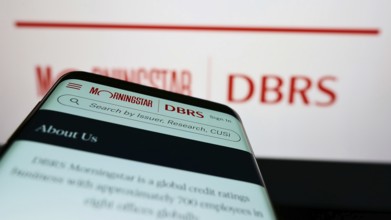 Stuttgart, Germany, 03-06-2022: Mobile phone with webpage of Canadian credit rating company DBRS