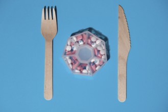 Organizer weekly shots with fork and knife medical pill box with doses of tablets for daily take
