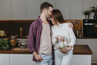 Front view loving couple preparing food home