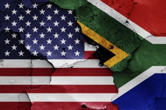 Flags of USA and South Africa painted on cracked wall
