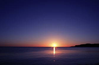 Sunset on sea water ocean horizon in Mediterranean
