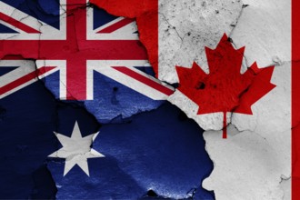 Flags of Australia and Canada painted on cracked wall