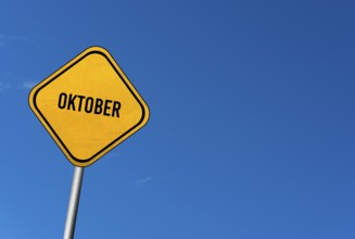 October, yellow sign with blü sky