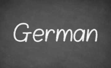 German lesson on blackboard or chalkboard. written in white chalk