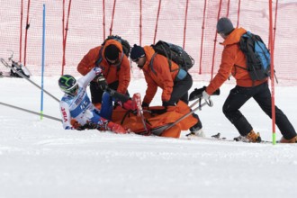 KAMCHATKA PENINSULA, RUSSIA, MAR 28, 2019: Rescuers Kamchatka Rescue Squad on alpine ski evacuate