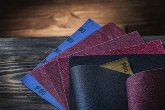 Sandpaper assortment on vintage wood background