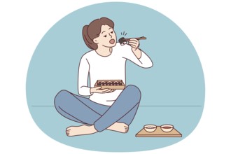 Happy young woman sit on floor eating sushi with chopsticks. Millennial female enjoy traditional