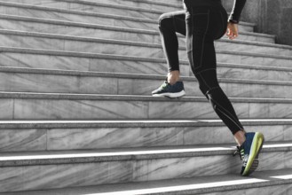 Side view man athletic wear exercising stairs outdoors