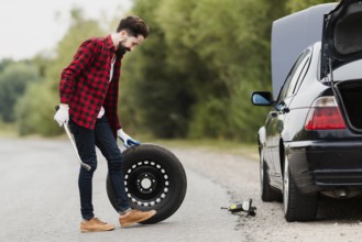 Side view man with spare tire