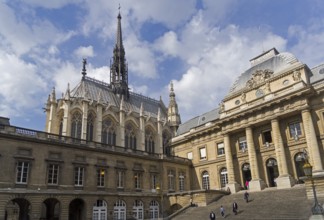 Sainte-Chapelle towers over the buildings of the Palais de Justice. Paris, France, Europe