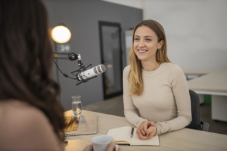 Smiley woman broadcasting interview radio