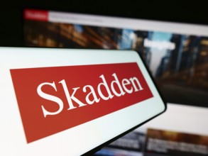 Stuttgart, Germany, 12-17-2023: Smartphone with logo of American law firm Skadden, Arps, Slate,