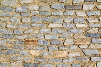 Stone pavement texture. Granite cobblestoned pavement background. Abstract background of old