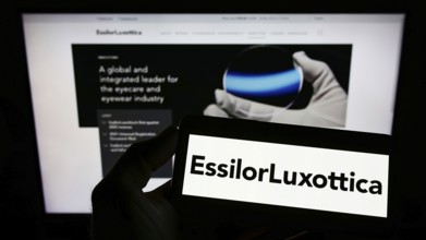 Stuttgart, Germany, 05-21-2022: Person holding smartphone with logo of French eyewear company