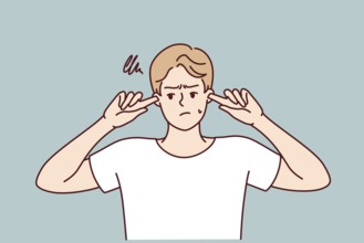 Offended guy closes ears does not want to hear toxic words or insults from peers or girlfriend.