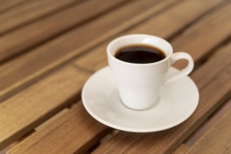 Tasty cup black coffee wooden table. High resolution photo