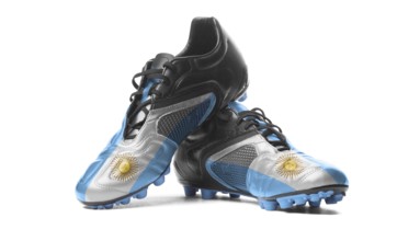 The Argentine flag painted on football boots. Isolated on white background