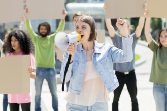 Front view woman with megaphone protesting street