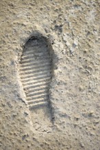 Footstep pattern seen on a concrete background