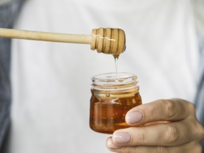 Hand holding sweet honey jar. Resolution and high quality beautiful photo