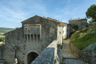 Banon. 15th century gate of the fortified enclosure listed as a historic monument.
