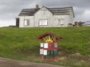 Derelict house on the shore of the Arctic Ocean, beside the town of Nesseby, May, Varangerfjord,
