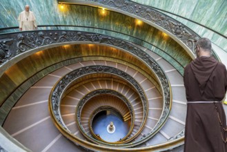 Spiral staircase Vatican with Pope Francis and monk Rome Italy people installed