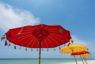 Traditional Balinese temple sunshade as parasol, Hinduism, symbol, beach holiday, protection, sun