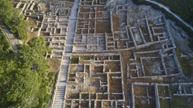 Drone shot, first morning light, Close aerial view of an ancient ruins site, detailed walls and