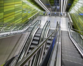 Modern metro station with smooth green walls and escalators, Frederiksberg Allé metro station,