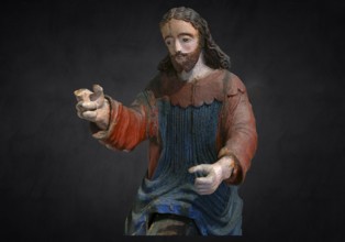 Christ on the palm donkey, on a dark background, detail, wooden figure from around 1400, Museum