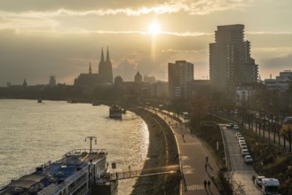The Rhine near Cologne, sunset, Cologne Cathedral, cargo ship, North Rhine-Westphalia, Germany,