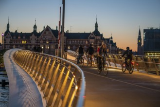 Cyclists on the Lille Langebro cycle and pedestrian bridge over the harbour, Copenhagen is