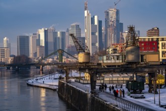 The skyline of Frankfurt am Main, skyscrapers of the banking district, historic harbour cranes at
