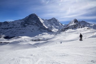 Skiing against the backdrop of the north face of the Eiger in Grindelwald, Switzerland, Europe